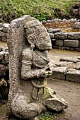 Candi Cetho - Sculptures of the eighth terrace holding his hands in a ritual gesture.